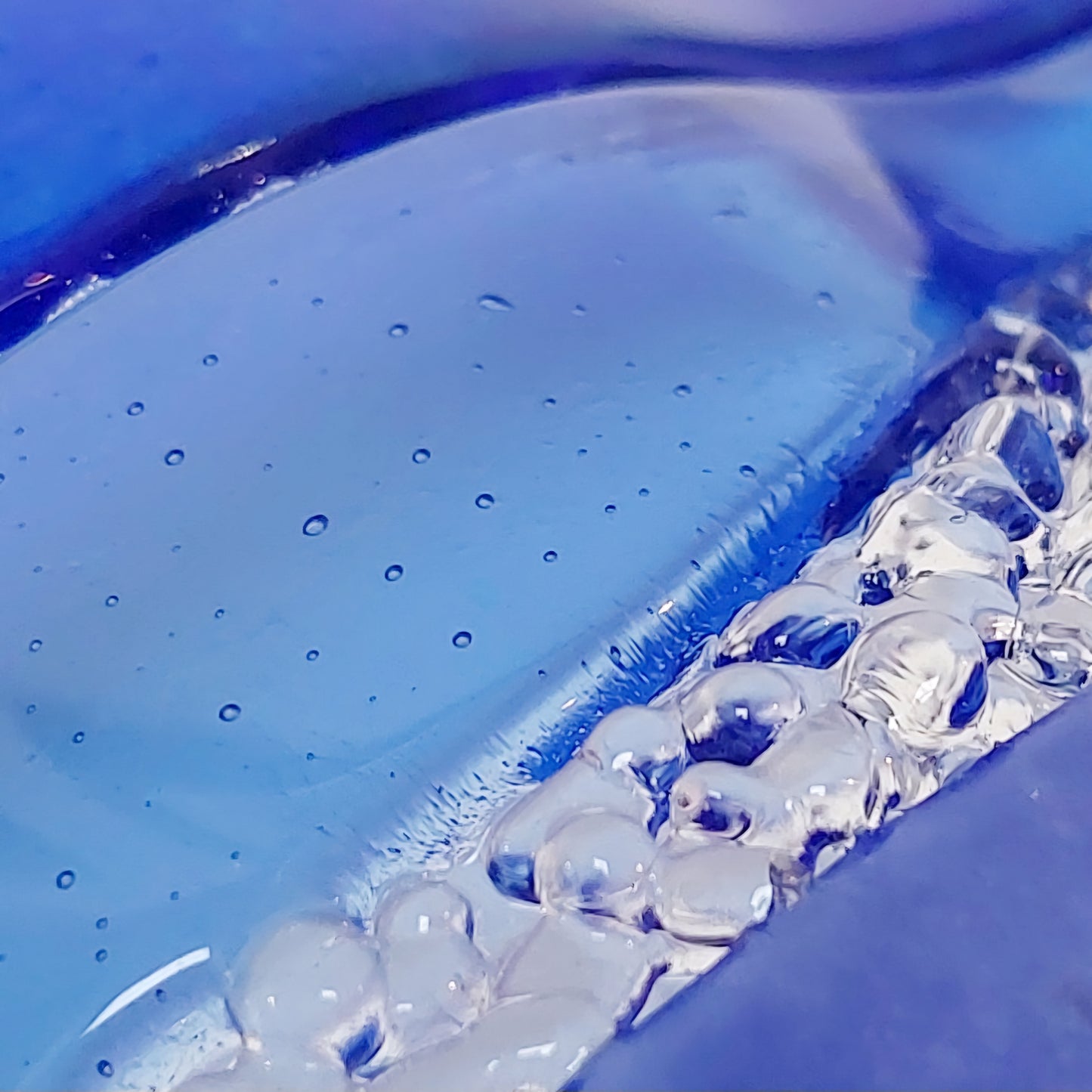 Sparkling Blue Glass Wave Ornament