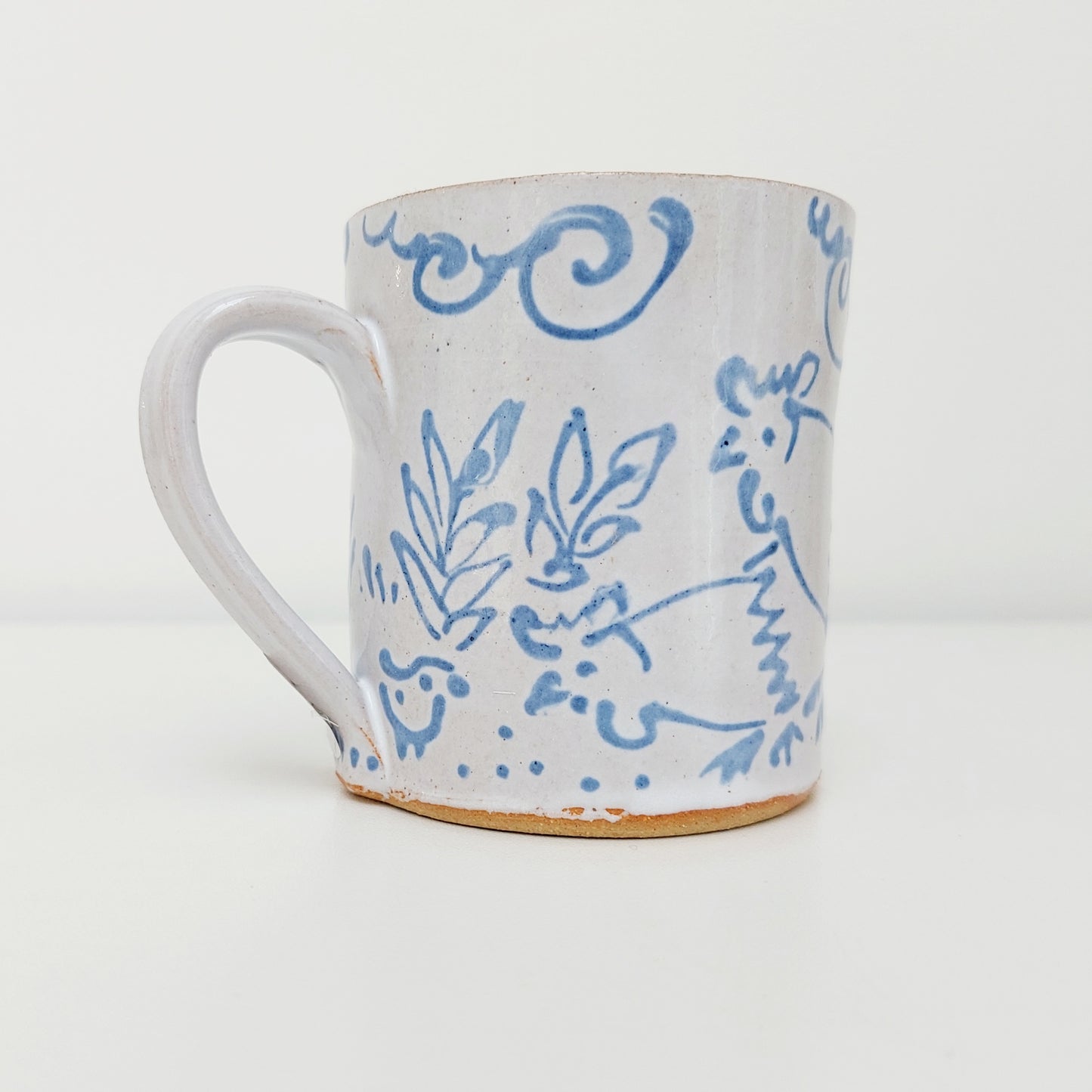 Handcrafted Earthenware Mug – Hans Ullrich | Blue & White Chicken Design