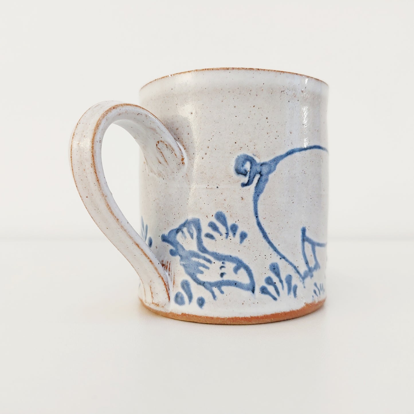 Handcrafted Earthenware Mug – Hans Ullrich | Blue & White Pig & Bird Design