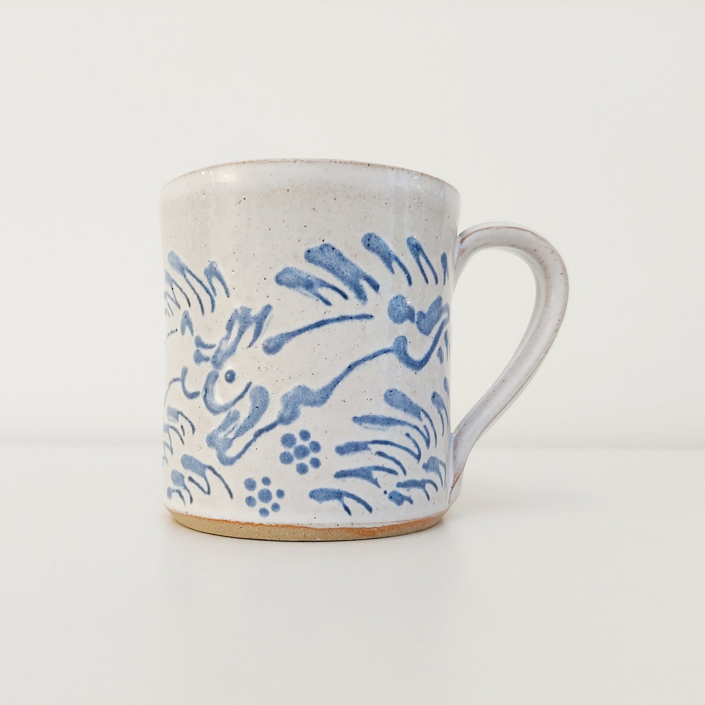 Handcrafted Earthenware Mug – Hans Ullrich | Blue & White Hare Design
