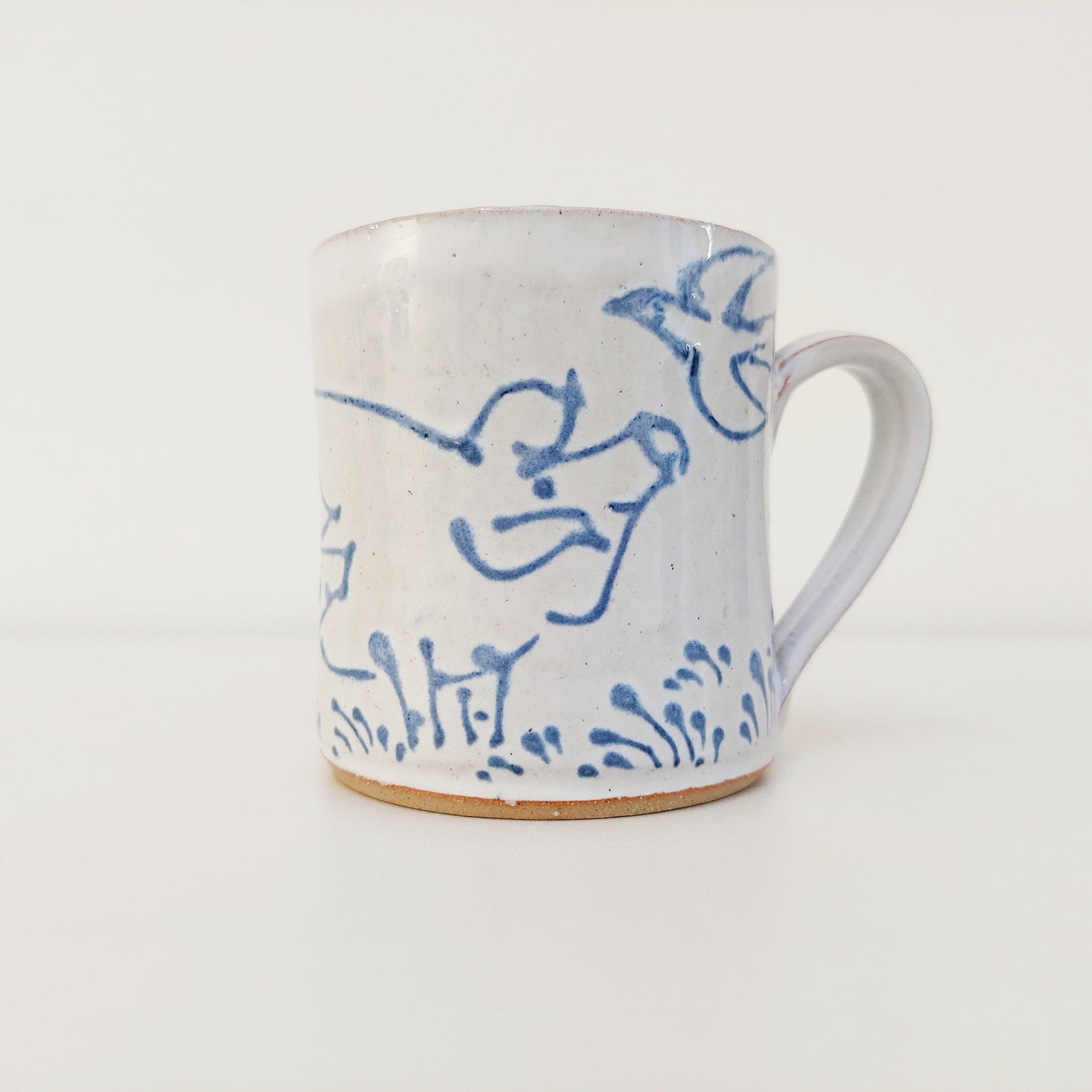Handcrafted Earthenware Mug – Hans Ullrich | Blue & White Pig & Bird Design