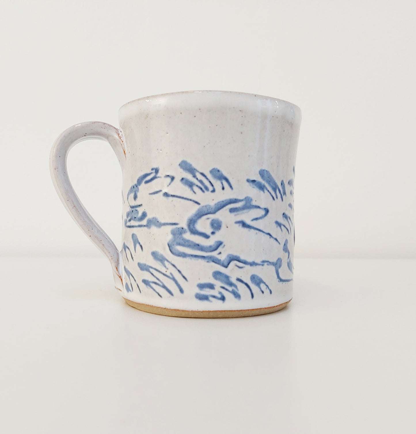 Handcrafted Earthenware Mug – Hans Ullrich | Blue & White Hare Design