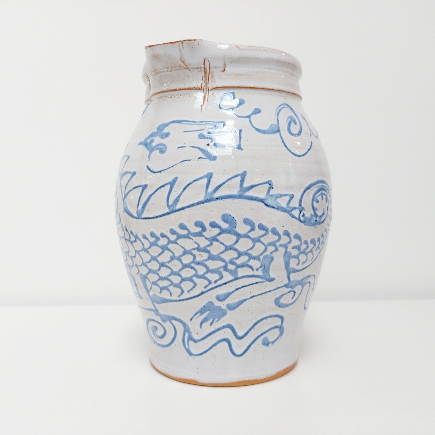 Blue & White Earthenware Jug with a Dragon Motif