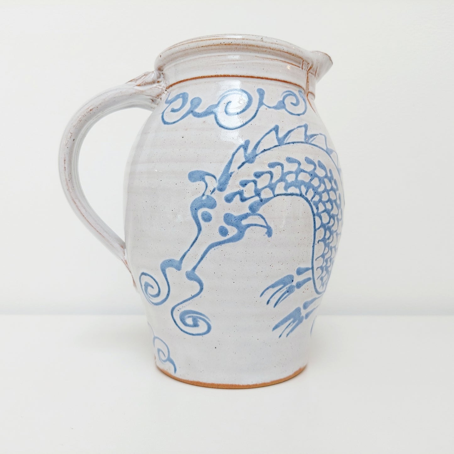 Blue & White Earthenware Jug with a Dragon Motif