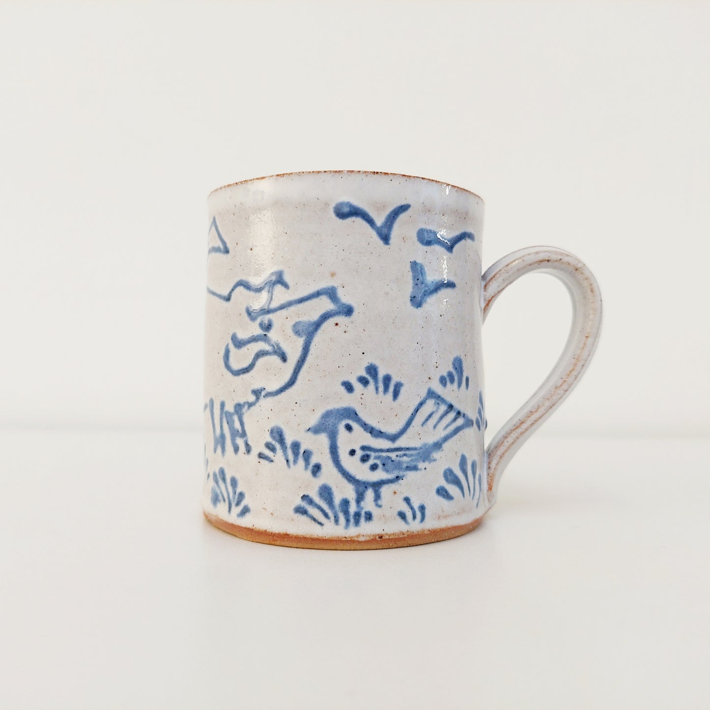 Handcrafted Earthenware Mug – Hans Ullrich | Blue & White Pig & Bird Design